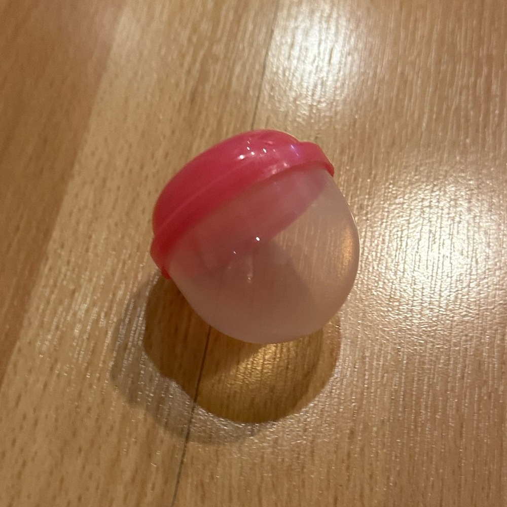 Small clear and pink treat ball